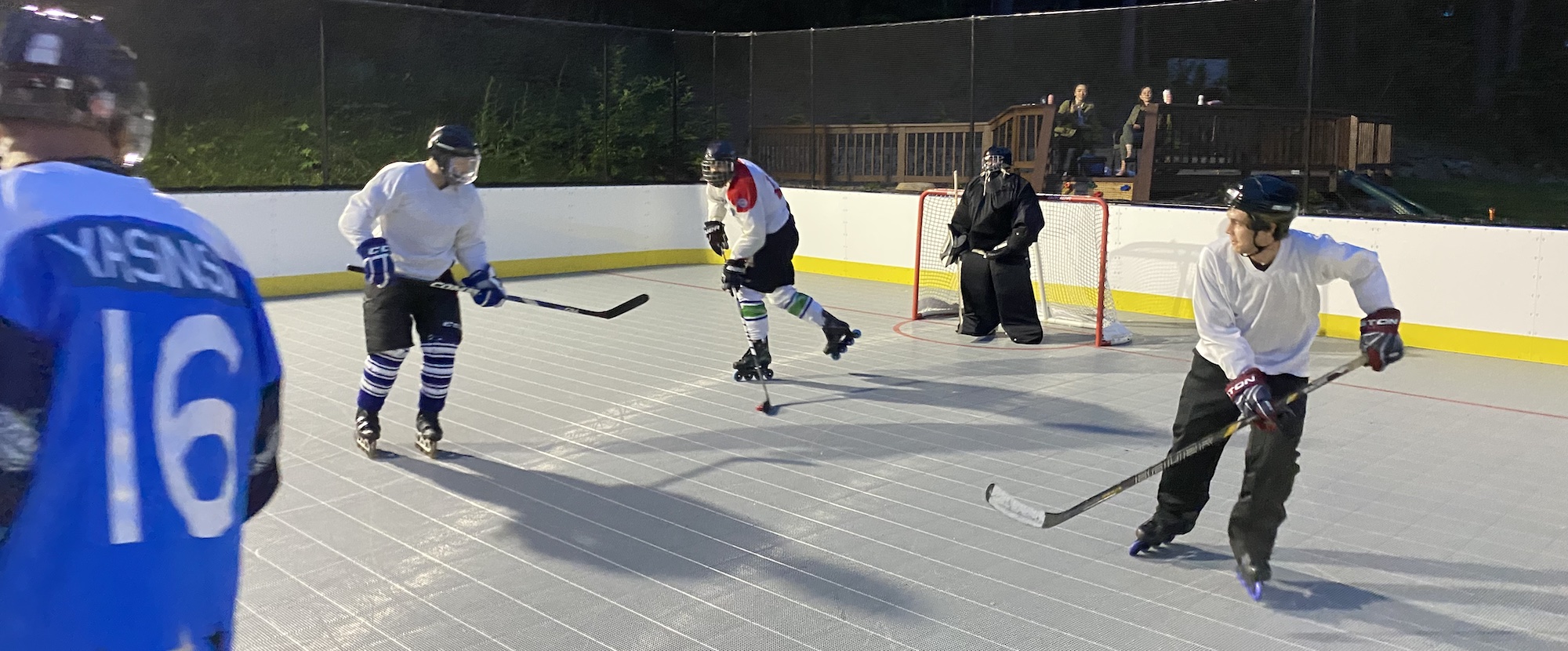 Photo of Roller hockey players mid-game